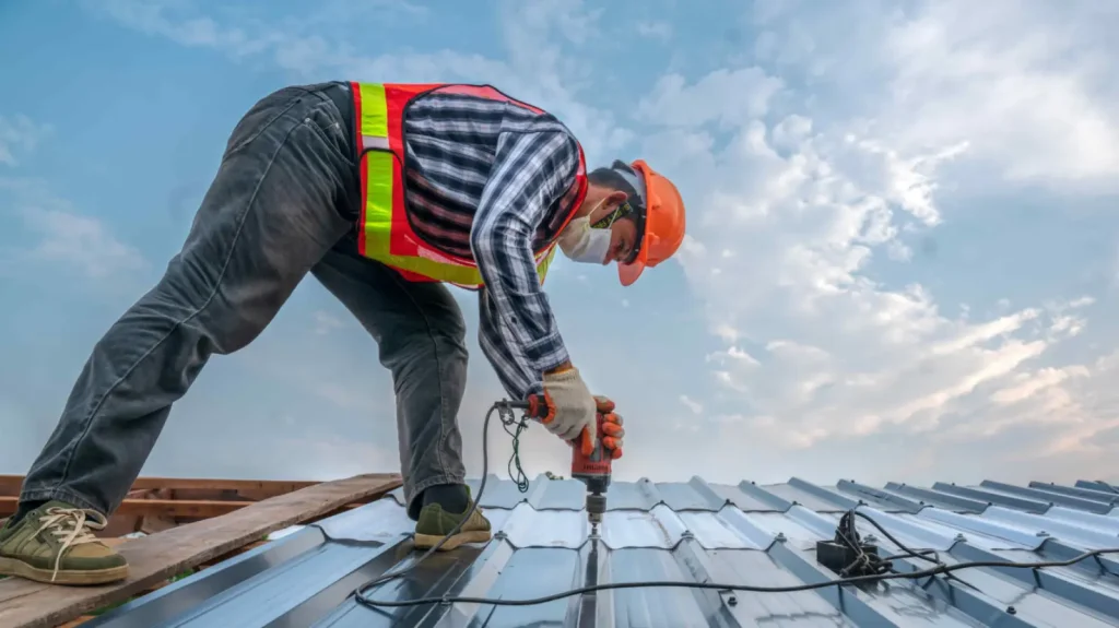 Commercial roof repair in Tampa FL with workers fixing leaks and damaged roofing areas