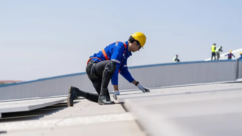 Commercial roof maintenance in Tampa FL with workers inspecting and servicing roofing system
